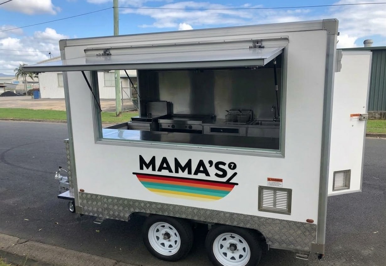 Mama’s 7 Colours mobile catering truck parked with its kitchen open